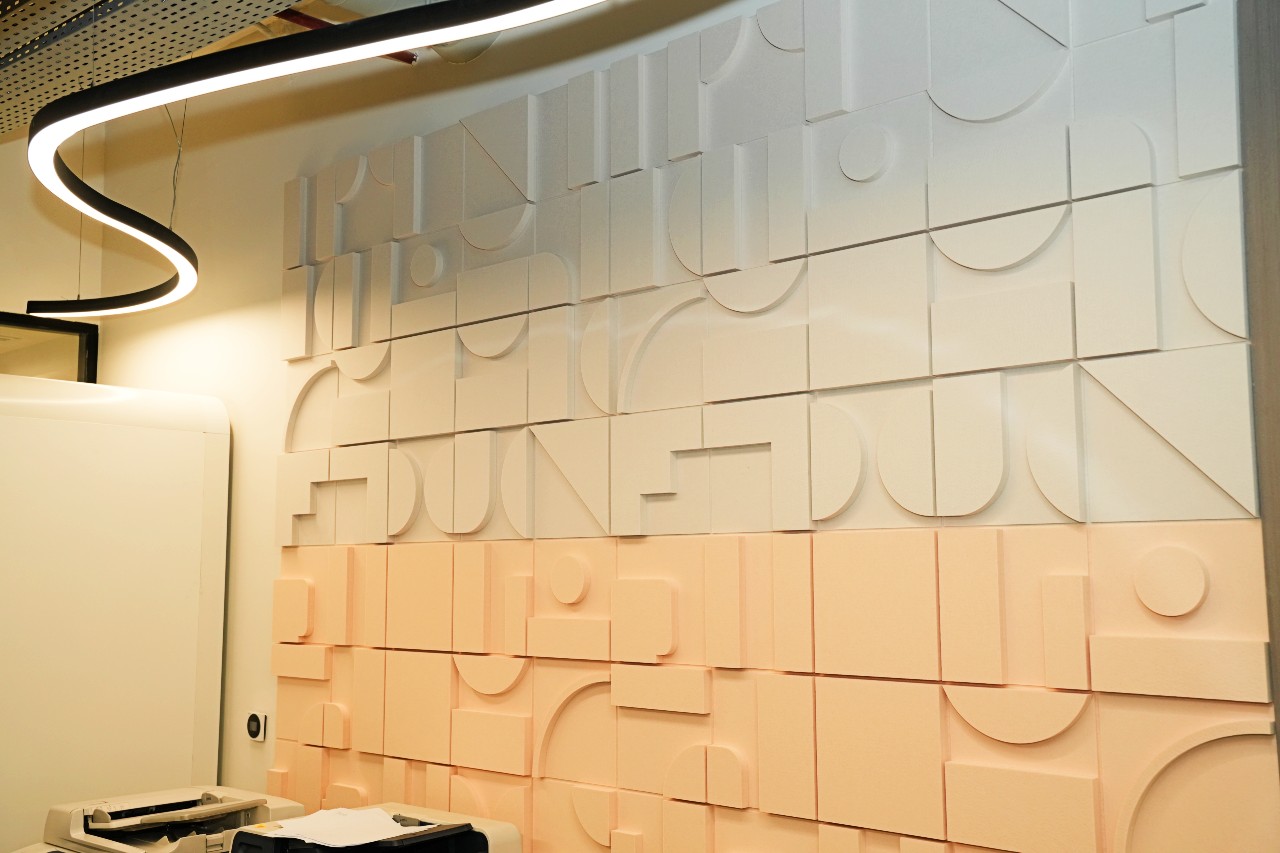 DecraLayer 3D acoustic wall panels installed as a decorative feature wall in a modern commercial interior.